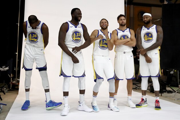 OAKLAND, CA - SEPTEMBER 24:  (L-R) Kevin Durant #35, Draymond Green #23, Stephen Curry #30, Klay Thompson #11, and DeMarcus Cousins #0 of the Golden State Warriors pose for a group picture during the Golden State Warriors media day on September 24, 2018 in Oakland, California.  (Photo by Ezra Shaw/Getty Images)