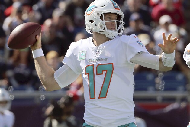 Miami Dolphins quarterback Ryan Tannehill (17) passes under pressure from the New England Patriots during the first half of an NFL football game, Sunday, Sept. 30, 2018, in Foxborough, Mass. (AP Photo/Elise Amendola)