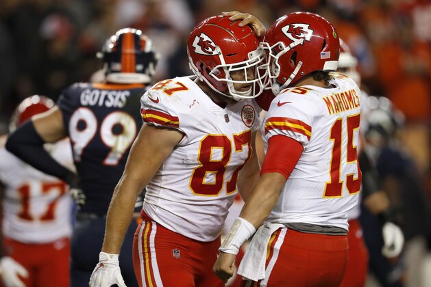 Kansas City Chiefs tight end Travis Kelce (87) celebrates his touchdown catch with quarterback Patrick Mahomes (15) during the second half of an NFL football game against the Denver Broncos, Monday, Oct. 1, 2018, in Denver. (AP Photo/David Zalubowski)