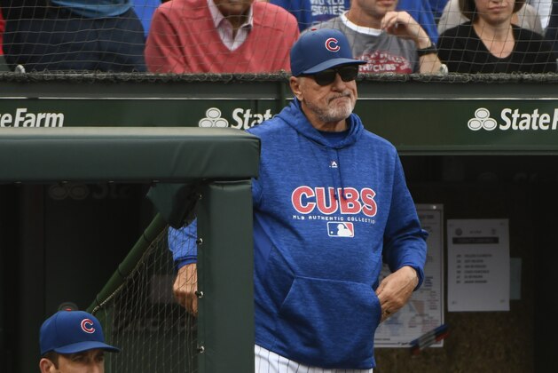 Chicago Cubs manager Joe Maddon (70) looks on after Milwaukee Brewers' Domingo Santana (16) scores during the eighth inning of a tie break baseball game against the Chicago Cubs on Monday, Oct. 1, 2018, in Chicago. (AP Photo/Matt Marton)