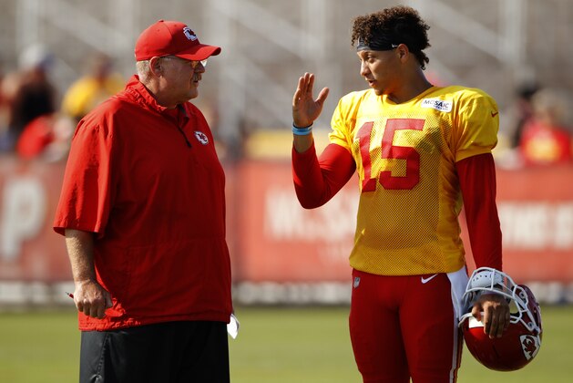 Kansas City Chiefs quarterback Patrick Mahomes (15) and coach Andy Reid talk during NFL football training camp Thursday, Aug. 2, 2018, in St. Joseph, Mo. (AP Photo/Charlie Riedel)