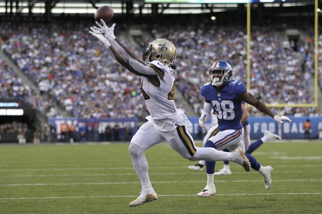 New Orleans Saints' Alvin Kamara, left, can't make the catch in the end zone during the first half of an NFL football game against the New York Giants, Sunday, Sept. 30, 2018, in East Rutherford, N.J. (AP Photo/Julio Cortez)