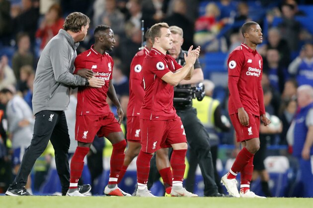 Liverpool's Xherdan Shaqiri, center and his teammates greet supporters a the end of the English Premier League soccer match between Chelsea and Liverpool at Stamford Bridge stadium in London, Saturday, Sept. 29, 2018. (AP Photo/Frank Augstein)