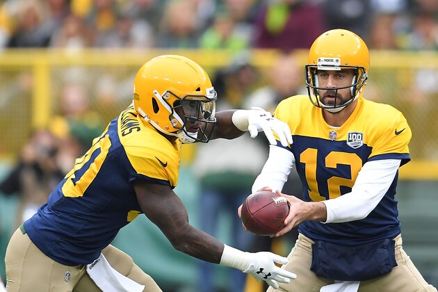GREEN BAY, WI - SEPTEMBER 30:  Aaron Rodgers #12 hands the ball to Jamaal Williams #30 of the Green Bay Packers during a game against the Buffalo Bills at Lambeau Field on September 30, 2018 in Green Bay, Wisconsin.  (Photo by Stacy Revere/Getty Images)