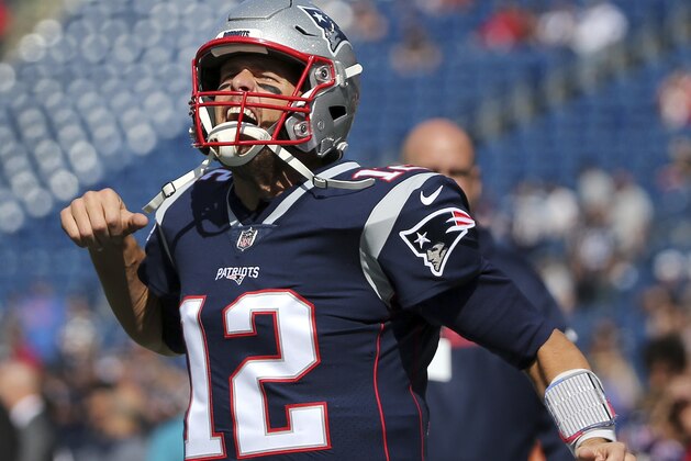 New England Patriots quarterback Tom Brady fires up the crowd as he takes the field before an NFL football game against the Miami Dolphins at Gillette Stadium, Sunday, Sept. 30, 2018, in Foxborough, Mass. (AP Photo/Elise Amendola)