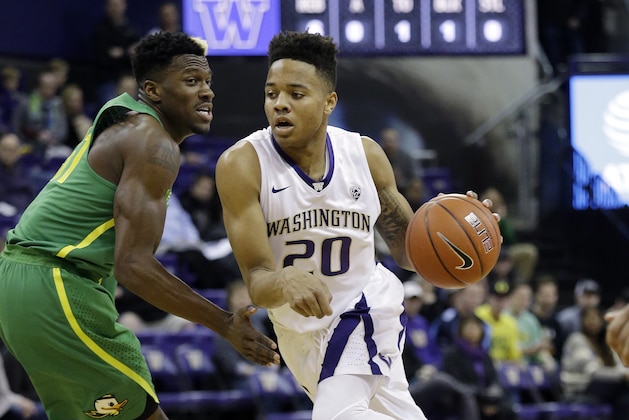 Washington's Markelle Fultz (20) tries to drive past Oregon's Dylan Ennis in the first half of an NCAA college basketball game Wednesday, Jan. 4, 2017, in Seattle. (AP Photo/Elaine Thompson)