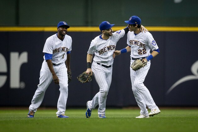 MILWAUKEE, WI - SEPTEMBER 29:  Lorenzo Cain #6, Ryan Braun #8, and Christian Yelich #22 of the Milwaukee Brewers celebrate after beating the Detroit Tigers 6-5 at Miller Park on September 29, 2018 in Milwaukee, Wisconsin.  (Photo by Dylan Buell/Getty Images)