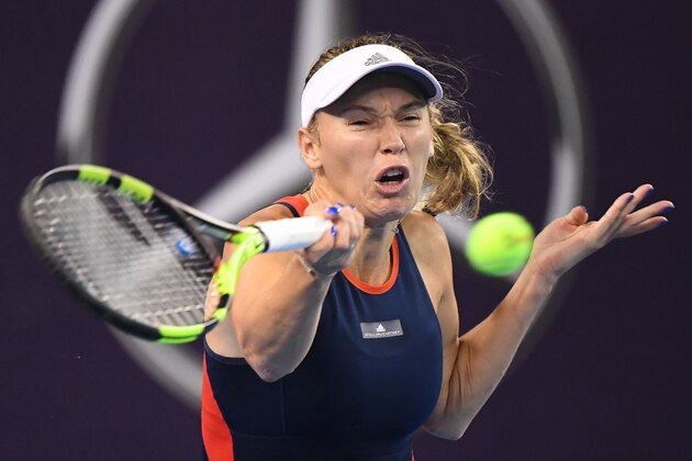 Caroline Wozniacki of Denmark hits a return during her women's singles third round match against Anett Kontaveit of Estonia at the China Open tennis tournament in Beijing on October 4, 2018. (Photo by GREG BAKER / AFP)        (Photo credit should read GREG BAKER/AFP/Getty Images)