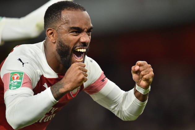 Arsenal's French striker Alexandre Lacazette celebrates scoring his team's third goal during the English League Cup third round football match between Arsenal and Brentford at the Emirates Stadium in London on September 26, 2018. (Photo by Glyn KIRK / AFP) / RESTRICTED TO EDITORIAL USE. No use with unauthorized audio, video, data, fixture lists, club/league logos or 'live' services. Online in-match use limited to 120 images. An additional 40 images may be used in extra time. No video emulation. Social media in-match use limited to 120 images. An additional 40 images may be used in extra time. No use in betting publications, games or single club/league/player publications. /         (Photo credit should read GLYN KIRK/AFP/Getty Images)