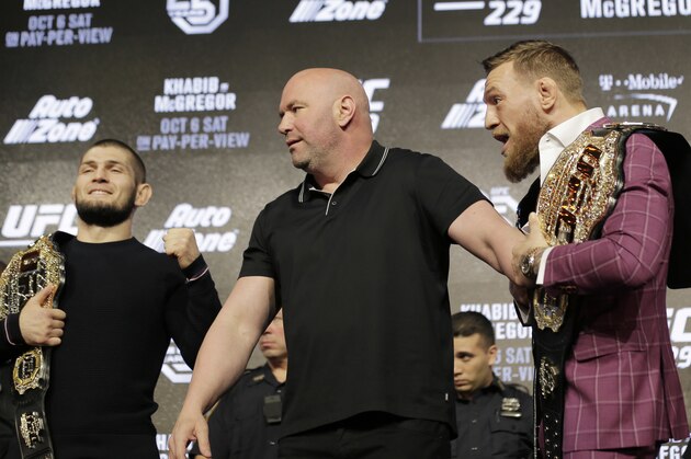 Conor McGregor, right, and Khabib Nurmagomedov, left, are separated by UFC president Dana White during a news conference in New York, Thursday, Sept. 20, 2018. McGregor is returning to UFC after a two-year absence. He fights undefeated Nurmagomedov on Oct. 6. (AP Photo/Seth Wenig)