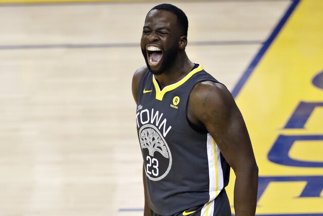Golden State Warriors forward Draymond Green (23) celebrates after scoring against the Cleveland Cavaliers during the first half of Game 2 of basketball's NBA Finals in Oakland, Calif., Sunday, June 3, 2018. (AP Photo/Marcio Jose Sanchez)