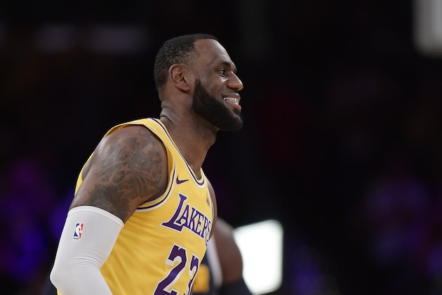 Los Angeles Lakers forward LeBron James smiles during the first half of an NBA basketball game against the Denver Nuggets Tuesday, Oct. 2, 2018, in Los Angeles. (AP Photo/Mark J. Terrill)