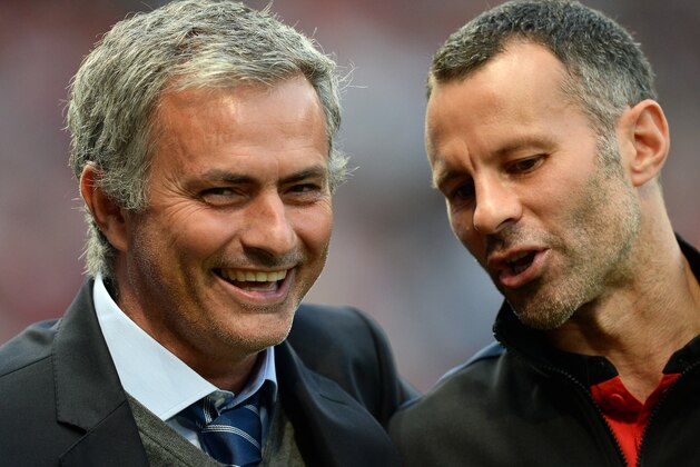 Chelsea's Portuguese manager Jose Mourinho (L) speaks to Manchester United's Welsh midfielder Ryan Giggs (R) ahead of the English Premier League football match between Manchester United and Chelsea at Old Trafford in Manchester, northwest England, on August 26, 2013. AFP PHOTO / ANDREW YATES  

RESTRICTED TO EDITORIAL USE. No use with unauthorized audio, video, data, fixture lists, club/league logos or live services. Online in-match use limited to 45 images, no video emulation. No use in betting, games or single club/league/player publications.        (Photo credit should read ANDREW YATES/AFP/Getty Images)