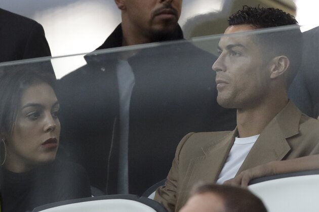 Juventus forward Cristiano Ronaldo and his partner Georgina sit in the stands prior to the Champions League, group H soccer match between Juventus and Young Boys, at the Allianz stadium in Turin, Italy, Tuesday, Oct. 2, 2018. (AP Photo/Luca Bruno)