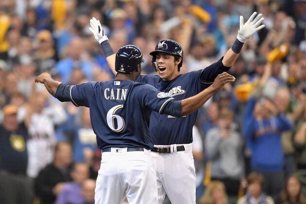 MILWAUKEE, WI - OCTOBER 04:  Christian Yelich #22 of the Milwaukee Brewers and Lorenzo Cain #6 celebrate after Yelich hit his two-run homerun in the third inning of Game One of the National League Division Series against the Colorado Rockies at Miller Park on October 4, 2018 in Milwaukee, Wisconsin.  (Photo by Stacy Revere/Getty Images)