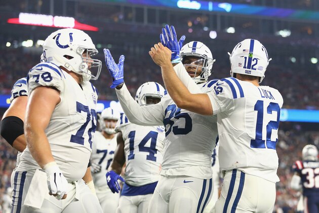 FOXBOROUGH, MA - OCTOBER 04:  Eric Ebron #85 and Andrew Luck #12 of the Indianapolis Colts celebrate with teammates after scoring a touchdown during the third quarter against the New England Patriots at Gillette Stadium on October 4, 2018 in Foxborough, Massachusetts.  (Photo by Adam Glanzman/Getty Images)