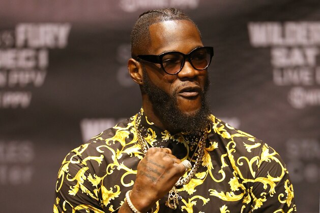 LOS ANGELES, CA - OCTOBER 03:  Deontay Wilder raises his fist onstage at The Novo by Microsoft to promote his upcoming December 1, 2018 fight against Tyson Fury in Los Angeles on October 3, 2018 in Los Angeles, California.  (Photo by Victor Decolongon/Getty Images)