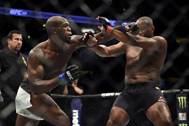 ANAHEIM, CA - JULY 29:  (L-R) Jon Jones punches Daniel Cormier in their UFC light heavyweight championship bout during the UFC 214 event inside the Honda Center on July 29, 2017 in Anaheim, California. (Photo by Jeff Bottari/Zuffa LLC/Zuffa LLC via Getty Images)