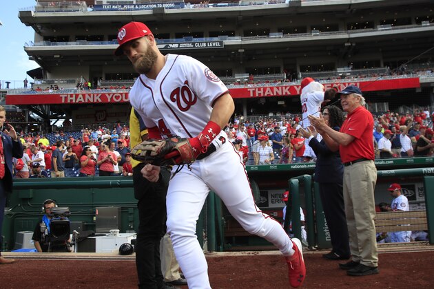 Washington Nationals right fielder Bryce Harper (34), runs to the field from the dug out at the start of the Nationals last home game of the season during a baseball game against the Miami Marlins in Washington, Wednesday, Sept. 26, 2018. (AP Photo/Manuel Balce Ceneta)