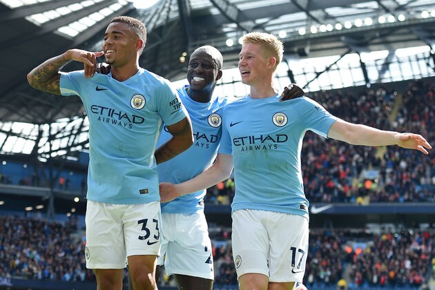 Manchester City's Brazilian striker Gabriel Jesus (L) celebrates with Manchester City's French defender Benjamin Mendy and Manchester City's Belgian midfielder Kevin De Bruyne (R) after scoring their second goal during the English Premier League football match between Manchester City and Liverpool at the Etihad Stadium in Manchester, north west England, on September 9, 2017. / AFP PHOTO / PAUL ELLIS / RESTRICTED TO EDITORIAL USE. No use with unauthorized audio, video, data, fixture lists, club/league logos or 'live' services. Online in-match use limited to 75 images, no video emulation. No use in betting, games or single club/league/player publications.  /         (Photo credit should read PAUL ELLIS/AFP/Getty Images)