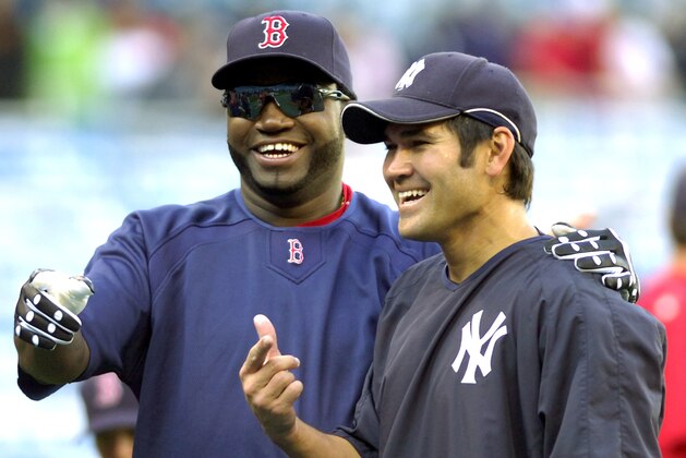 Boston Red Sox's David Ortiz, left, and New York Yankees' Johnny Damon talk during warmups before MLB baseball Monday, May 21, 2007 at Yankee Stadium in New York. (AP Photo/Bill Kostroun)