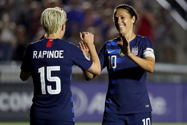 CARY, NC - OCTOBER 04:  Megan Rapinoe #15 reacts after scoring a goal with teammate Carli Lloyd #10 of USA against Mexico during the Group A - CONCACAF Women's Championship at WakeMed Soccer Park on October 4, 2018 in Cary, North Carolina.  (Photo by Streeter Lecka/Getty Images)