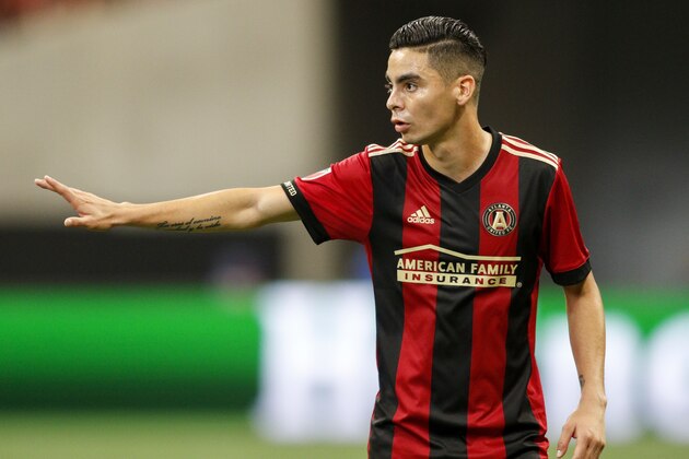 Atlanta United midfielder Miguel Almiron (10) talks to teammates in the first half of an MLS soccer match against the Portland Timbers, Sunday, June 24, 2018, in Atlanta. (AP Photo/Brett Davis)