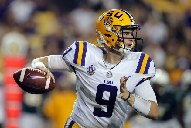FILE - In this Saturday, Sept. 8, 2018, file photo, LSU quarterback Joe Burrow (9) scrambles as he looks for a receiver in the second half of an NCAA college football game against Southeastern Louisiana in Baton Rouge, La. Burrow says he's not entirely happy with how he's played, but he suspects the sixth-ranked Tigers' passing game is on the cusp of considerable improvement. (AP Photo/Gerald Herbert, File)
