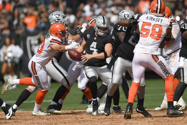 OAKLAND, CA - SEPTEMBER 30:  Joe Schobert #53 of the Cleveland Browns sacks quarterback Derek Carr #4 of the Oakland Raiders during the second quarter of their NFL football game at Oakland-Alameda County Coliseum on September 30, 2018 in Oakland, California.  (Photo by Thearon W. Henderson/Getty Images)
