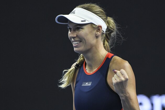 Caroline Wozniacki of Denmark reacts after she won the game during her women's semi-final match against Wang Qiang of China at the China Open tennis tournament in Beijing on October 6, 2018. - Wozniacki won 6-1, 6-3. (Photo by FRED DUFOUR / AFP)        (Photo credit should read FRED DUFOUR/AFP/Getty Images)