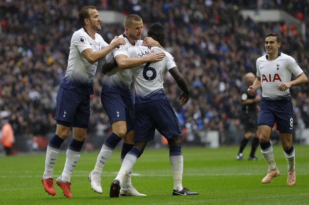 Tottenham's Eric Dier, center left, celebrates with teammates after scoring his side's opening goal during the English Premier League soccer match between Tottenham Hotspur and Cardiff City at Wembley stadium in London, Saturday, Oct. 6, 2018. (AP Photo/Kirsty Wigglesworth)