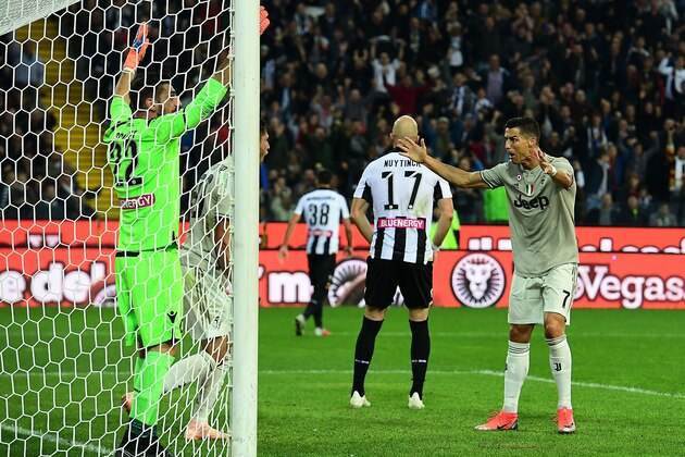 Juventus' Portuguese forward Cristiano Ronaldo (R) gestures during the Italian Serie A football match Udinese Calcio vs Juventus FC at the Dacia Arena stadium in Udine on October 6, 2018. (Photo by Miguel MEDINA / AFP)        (Photo credit should read MIGUEL MEDINA/AFP/Getty Images)