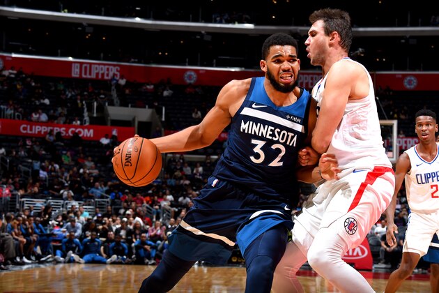 LOS ANGELES, CA - OCTOBER 3: Karl-Anthony Towns #32 of the Minnesota Timberwolves handles the ball against the LA Clippers during a pre-season game on October 3, 2018 at Staples Center in Los Angeles, California. NOTE TO USER: User expressly acknowledges and agrees that, by downloading and or using this photograph, User is consenting to the terms and conditions of the Getty Images License Agreement. Mandatory Copyright Notice: Copyright 2018 NBAE (Photo by Andrew D. Bernstein/NBAE via Getty Images)