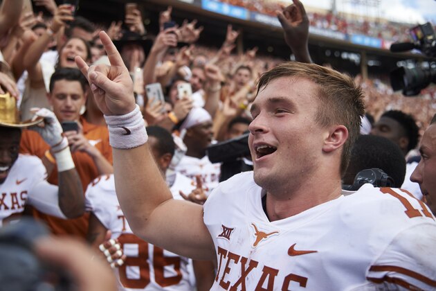 Texas quarterback Sam Ehlinger (11) celebrates after defeating Oklahoma 48-45 in an NCAA college football game at the Cotton Bowl, Saturday, Oct. 6, 2018, in Dallas. (AP Photo/Cooper Neill)