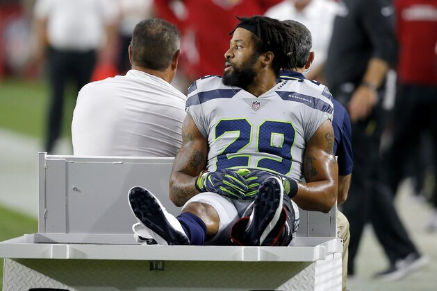 Seattle Seahawks defensive back Earl Thomas (29) leaves the field after breaking his leg against the Arizona Cardinals during the second half of an NFL football game, Sunday, Sept. 30, 2018, in Glendale, Ariz. The Seahawks won 20-17. (AP Photo/Ross D. Franklin)