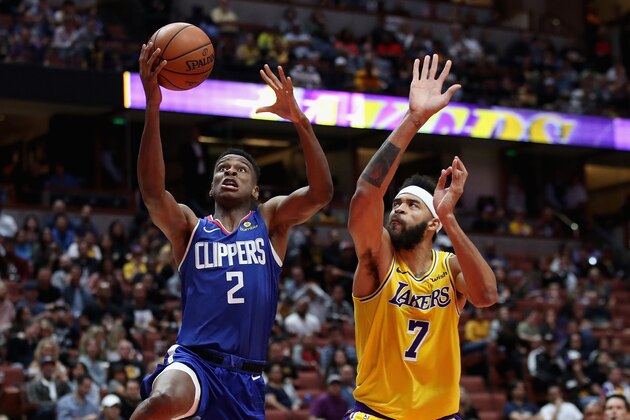 ANAHEIM, CA - OCTOBER 06:  Shai Gilgeous-Alexander #2 of the LA Clippers dribbles past JaVale McGee #7 of the Los Angeles Lakers during the first half of a NBA preseason game at Honda Center on October 6, 2018 in Anaheim, California.  NOTE TO USER: User expressly acknowledges and agrees that, by downloading and or using this photograph, User is consenting to the terms and conditions of the Getty Images License Agreement.  (Photo by Sean M. Haffey/Getty Images)