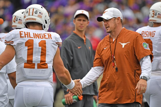 MANHATTAN, KS - SEPTEMBER 29:  Head coach Tom Herman  (R) of the Texas Longhorns shakes hands with quarterback Sam Ehlinger #11 during pre-game activities, prior to a game against the Kansas State Wildcats on September 29, 2018 at Bill Snyder Family Stadium in Manhattan, Kansas.  (Photo by Peter G. Aiken/Getty Images)