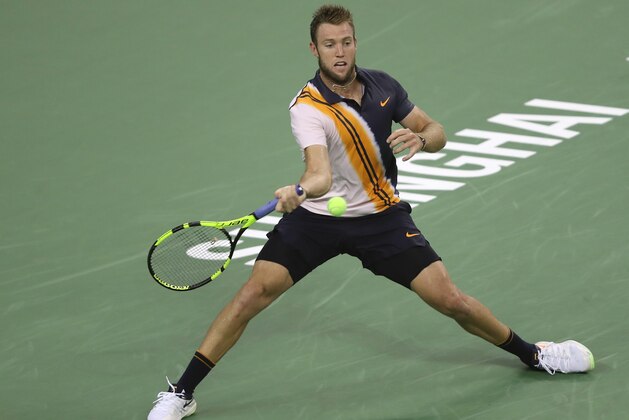 SHANGHAI, CHINA - OCTOBER 07:  Jack Sock of United States returns a shot to Peter Gojowczyk of Germany during their  First Round match at 2018 Rolex Shanghai Masters on Day 1 at Qi Zhong Tennis Centre on October 7, 2018 in Shanghai, China.  (Photo by Kevin Lee/Getty Images)