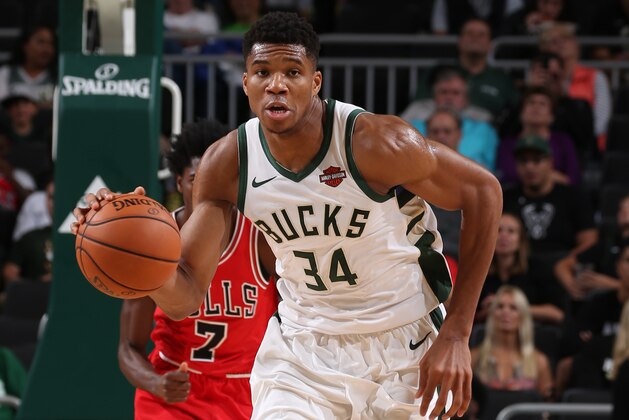 MILWAUKEE, WI - OCTOBER 3: Giannis Antetokounmpo #34 of the Milwaukee Bucks handles the ball against the Chicago Bulls during a pre-season game on October 3, 2018 at Fiserv Forum, in Milwaukee, Wisconsin. NOTE TO USER: User expressly acknowledges and agrees that, by downloading and/or using this Photograph, user is consenting to the terms and conditions of the Getty Images License Agreement. Mandatory Copyright Notice: Copyright 2018 NBAE (Photo by Gary Dineen/NBAE via Getty Images) MILWAUKEE, WI - OCTOBER 3: Giannis Antetokounmpo #34 of the Milwaukee Bucks handles the ball against the Chicago Bulls during a pre-season game on October 3, 2018 at Fiserv Forum, in Milwaukee, Wisconsin. NOTE TO USER: User expressly acknowledges and agrees that, by downloading and/or using this Photograph, user is consenting to the terms and conditions of the Getty Images License Agreement. Mandatory Copyright Notice: Copyright 2018 NBAE (Photo by Gary Dineen/NBAE via Getty Images)