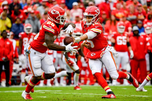 KANSAS CITY, MO - OCTOBER 7: Patrick Mahomes #15 of the Kansas City Chiefs hands the ball off to teammate Damien Williams #26 during the second quarter of the game against the Jacksonville Jaguars at Arrowhead Stadium on October 7, 2018 in Kansas City, Missouri. (Photo by Peter Aiken/Getty Images)