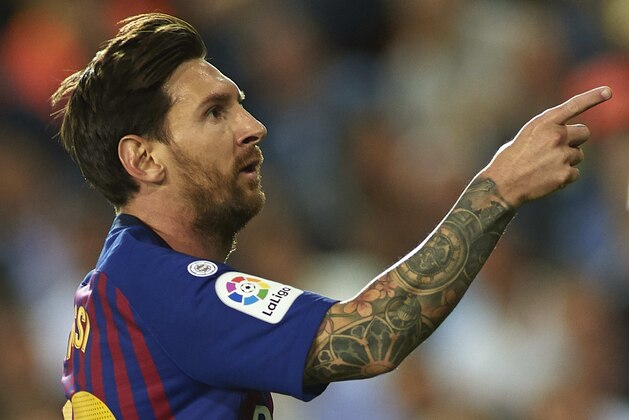 VALENCIA, SPAIN - OCTOBER 07:  Lionel Messi of Barcelona celebrates after scoring his sides first goal during the La Liga match between Valencia CF and FC Barcelona at Estadio Mestalla on October 7, 2018 in Valencia, Spain.  (Photo by Manuel Queimadelos Alonso/Getty Images)