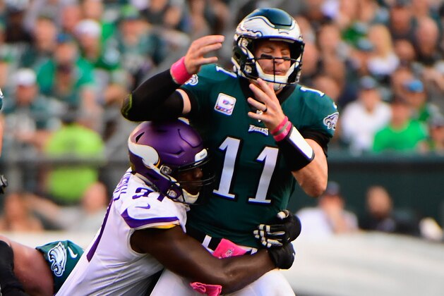 PHILADELPHIA, PA - OCTOBER 07:  Quarterback Carson Wentz #11 of the Philadelphia Eagles is sacked by defensive end Stephen Weatherly #91 of the Minnesota Vikings during the second quarter at Lincoln Financial Field on October 7, 2018 in Philadelphia, Pennsylvania. This play results in a 64-yard fumble recovery by defensive tackle Linval Joseph #98 of the Minnesota Vikings for a touchdown.  (Photo by Corey Perrine/Getty Images)