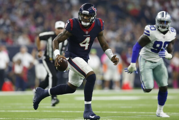 HOUSTON, TX - OCTOBER 07:  Deshaun Watson #4 of the Houston Texans scrables under pressure from Demarcus Lawrence #90 of the Dallas Cowboys in the first quarter at NRG Stadium on October 7, 2018 in Houston, Texas.  (Photo by Tim Warner/Getty Images)
