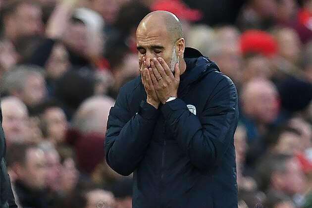Manchester City's Spanish manager Pep Guardiola reacts after Liverpool's Dutch defender Virgil van Dijk cleared the ball with his arm, but was fouled by Manchester City's Brazilian midfielder Fernandinho in the process, during the English Premier League football match between Liverpool and Manchester City at Anfield in Liverpool, north west England on October 7, 2018. (Photo by Paul ELLIS / AFP) / RESTRICTED TO EDITORIAL USE. No use with unauthorized audio, video, data, fixture lists, club/league logos or 'live' services. Online in-match use limited to 120 images. An additional 40 images may be used in extra time. No video emulation. Social media in-match use limited to 120 images. An additional 40 images may be used in extra time. No use in betting publications, games or single club/league/player publications. /         (Photo credit should read PAUL ELLIS/AFP/Getty Images)