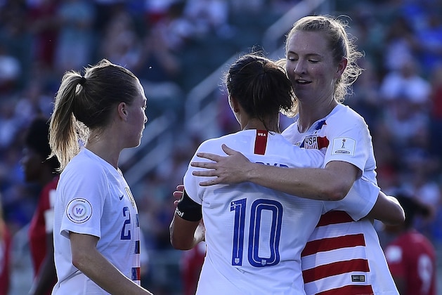 CARY, NC - OCTOBER 07: Carli Lloyd #10 embraces Samantha Mewis #3 as Emily Sonnett #2 of the USA Looks on after Lloyd scores a goal against Panama during the soccer game at WakeMed Soccer Park on October 7, 2018 in Cary, North Carolina. (Photo by Mike Comer/Getty Images)