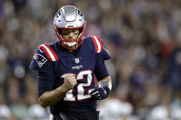 New England Patriots quarterback Tom Brady pumps his fist after throwing a touchdown pass to Cordarrelle Patterson during the first half of an NFL football game against the Indianapolis Colts, Thursday, Oct. 4, 2018, in Foxborough, Mass. (AP Photo/Charles Krupa)