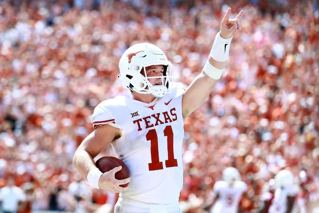 DALLAS, TX - OCTOBER 06:  Sam Ehlinger #11 of the Texas Longhorns celebrates after scoring a touchdown against the Oklahoma Sooners in the third quarter of the 2018 AT&T Red River Showdown at Cotton Bowl on October 6, 2018 in Dallas, Texas.  (Photo by Tom Pennington/Getty Images)