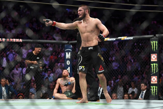 LAS VEGAS, NV - OCTOBER 06:  (R-L) Khabib Nurmagomedov of Russia reacts after submitting Conor McGregor of Ireland in their UFC lightweight championship bout during the UFC 229 event inside T-Mobile Arena on October 6, 2018 in Las Vegas, Nevada. (Photo by Jeff Bottari/Zuffa LLC/Zuffa LLC via Getty Images)