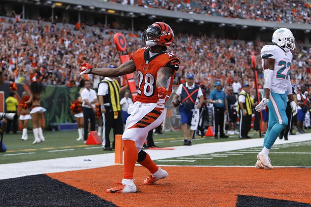 Cincinnati Bengals running back Joe Mixon (28) celebrates a touchdown against the Miami Dolphins during the second half of an NFL football game in Cincinnati, Sunday, Oct. 7, 2018. (AP Photo/Frank Victores)