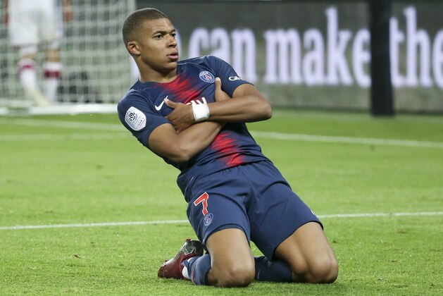 PARIS, FRANCE - OCTOBER 7: Kylian Mbappe of PSG celebrates his goal during the french Ligue 1 match between Paris Saint-Germain (PSG) and Olympique Lyonnais (OL, Lyon) at Parc des Princes stadium on October 7, 2018 in Paris, France. (Photo by Jean Catuffe/Getty Images)